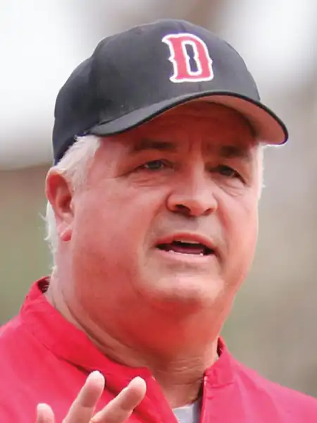 A boston red sox baseball coach is talking to the camera.